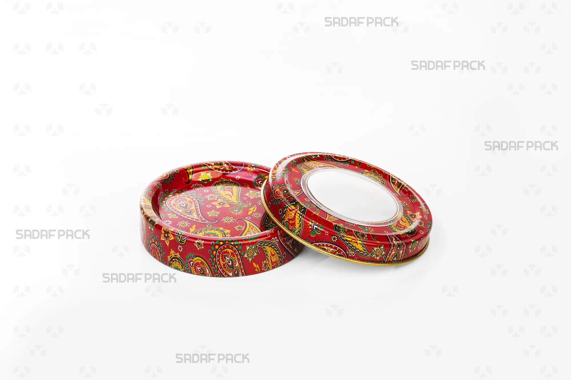 Overhead view of the empty Sadaf Pack 3 gram metal tin and its corresponding lid, both featuring the detailed red Termeh design.