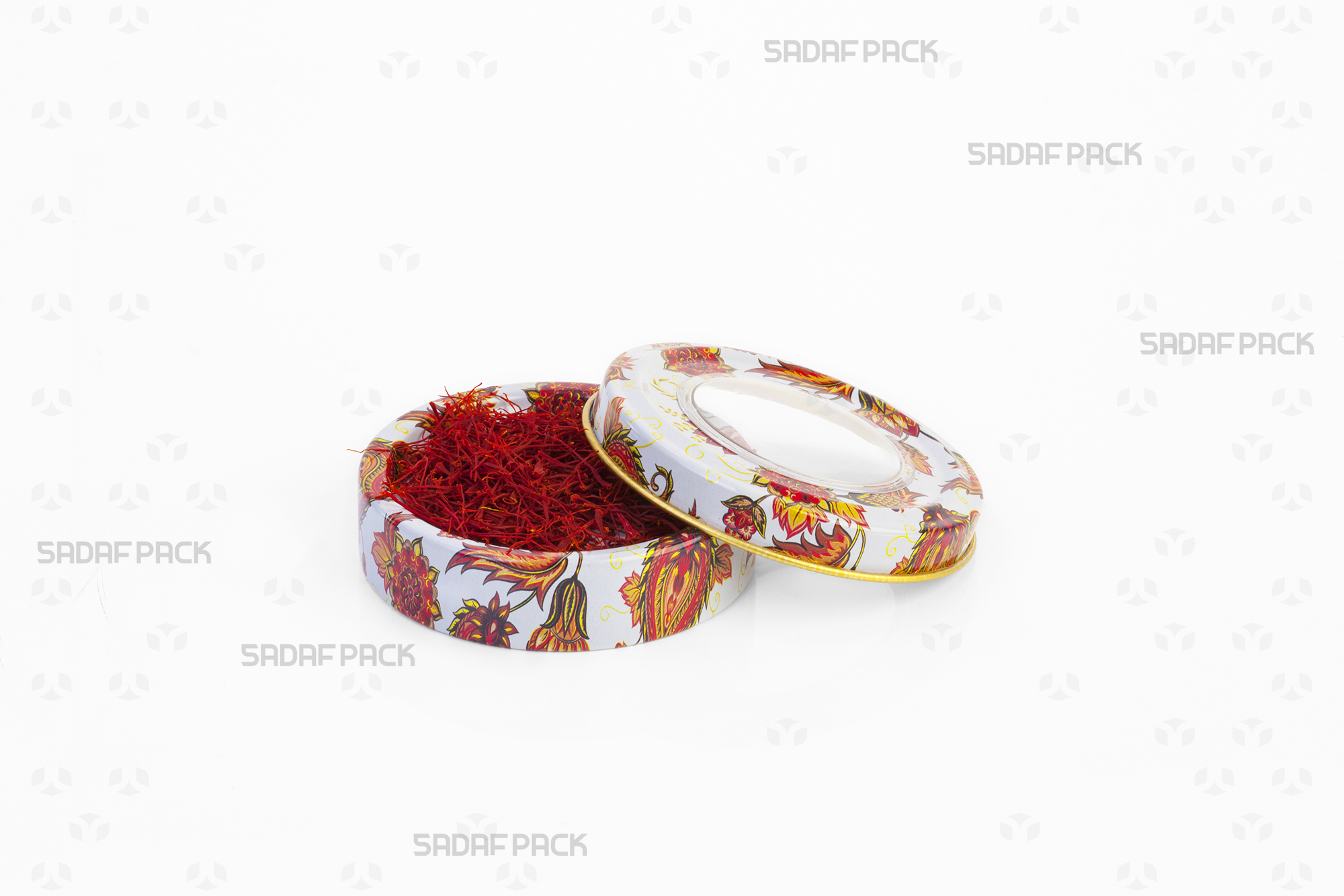 A top-down view of the Sadaf Pack 3 gram metal tin with the Toranj White design, shown with the lid open and filled with high-quality saffron threads to display its capacity.