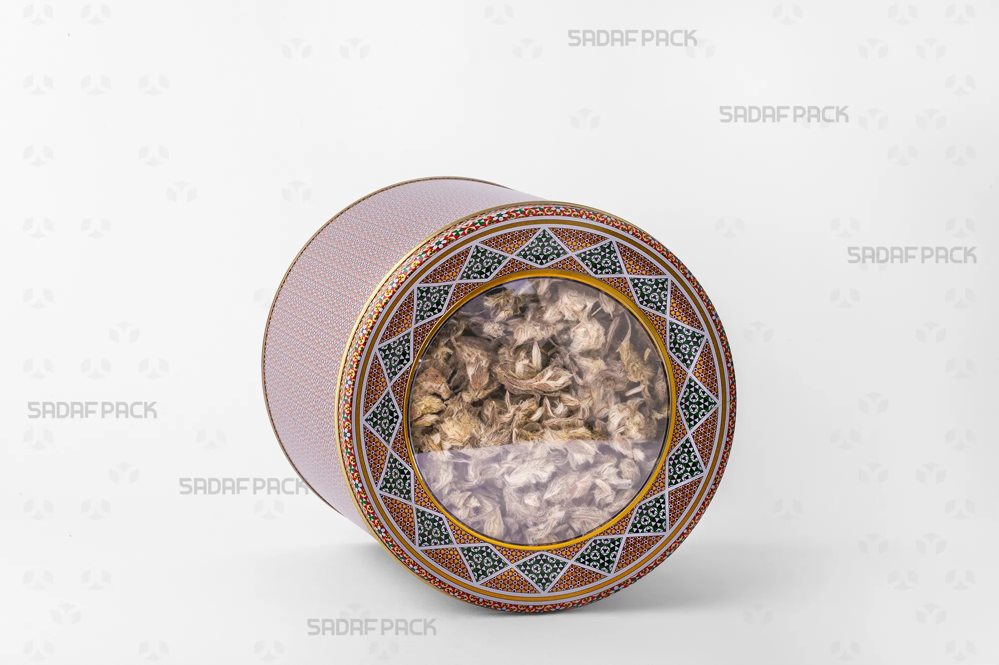 A 17 Metal 15 cm tin filled with Mountain Herbal Tea, demonstrating its large capacity for export-quality bulk goods.