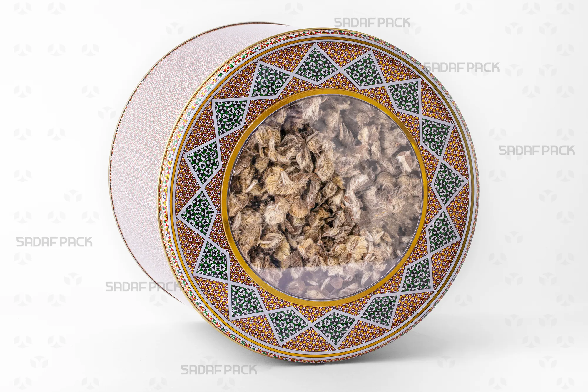 Three-quarter angle view of the 23x15 cm metal tin filled with Mountain Herbal Tea, showcasing its capacity for bulk export products.