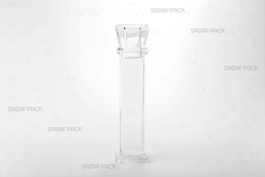 Front angle view of the Royal container, highlighting its transparent poly-crystal structure and the magnifying lens effect for viewing saffron threads.