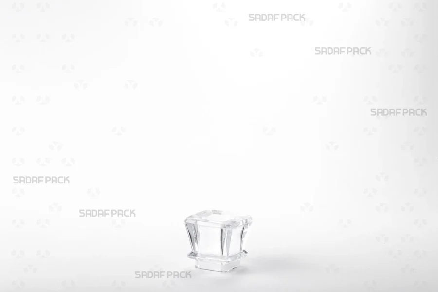 A detailed three-quarter angle view of the Royal container's angled lid, showing the plastic strip designed to preserve saffron aroma.