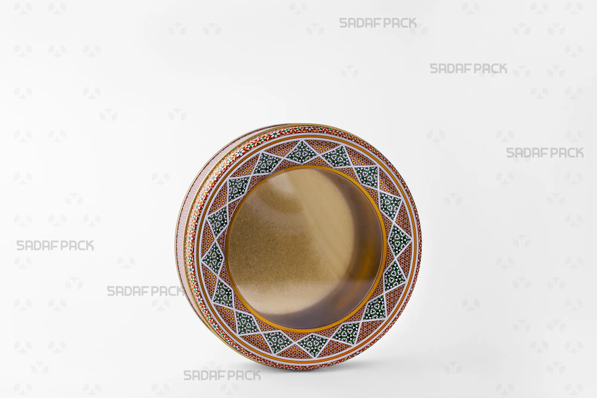 Three-quarter view of the 17 cm Metal Tin with 3 cm height by Sadaf Pack, showing its wide, circular design and clear polycrystal window lid.