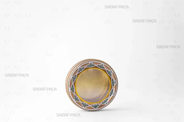 A 12 Metal 2 cm round tin container from Sadaf Pack, shown at a three-quarter angle with its lid on.