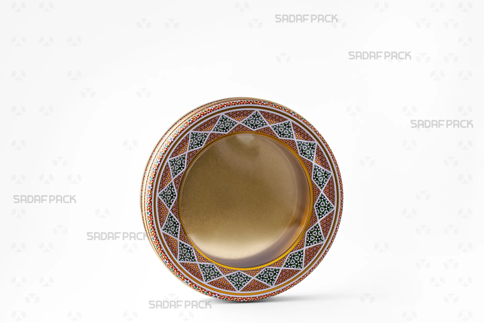 Three-quarter view of the 17 Metal 2 cm circular tin, a wide, shallow metal container by Sadaf Pack.