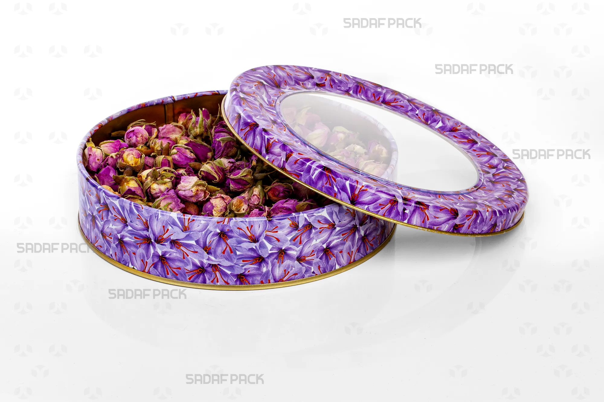 Top-down view of the Sadaf Pack 17cm x 3cm round metal tin, showing the open lid and base with the Saffron Flower design, filled with dried rosebuds to display capacity.