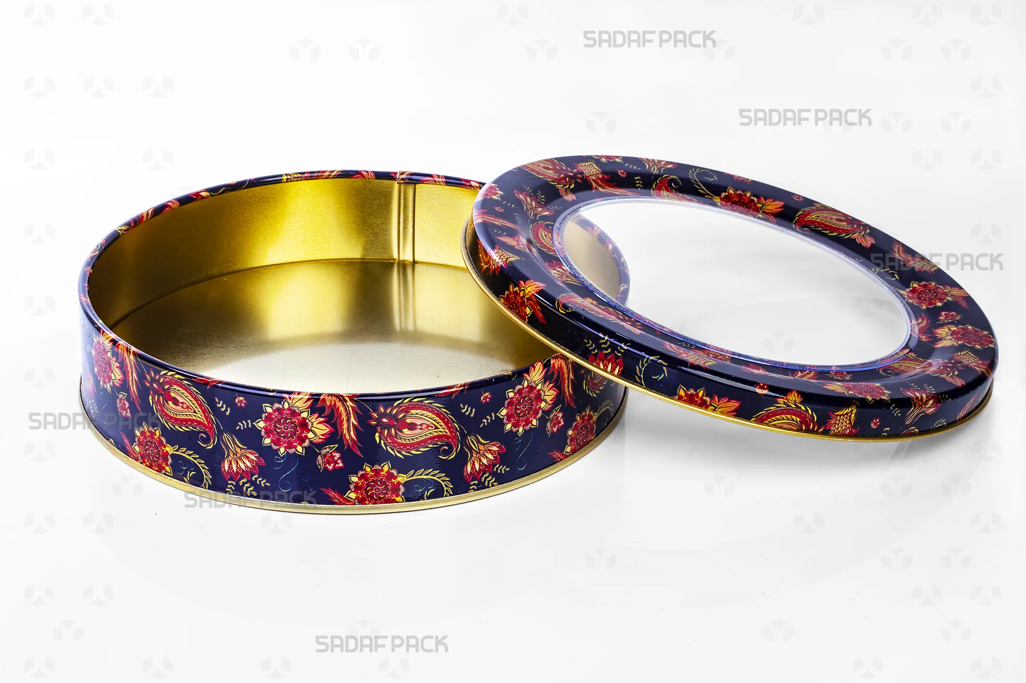 Top-down view of the empty Sadaf Pack 17cm x 3cm round metal tin, displaying the interior capacity and the navy blue Toranj pattern on the open lid and base.