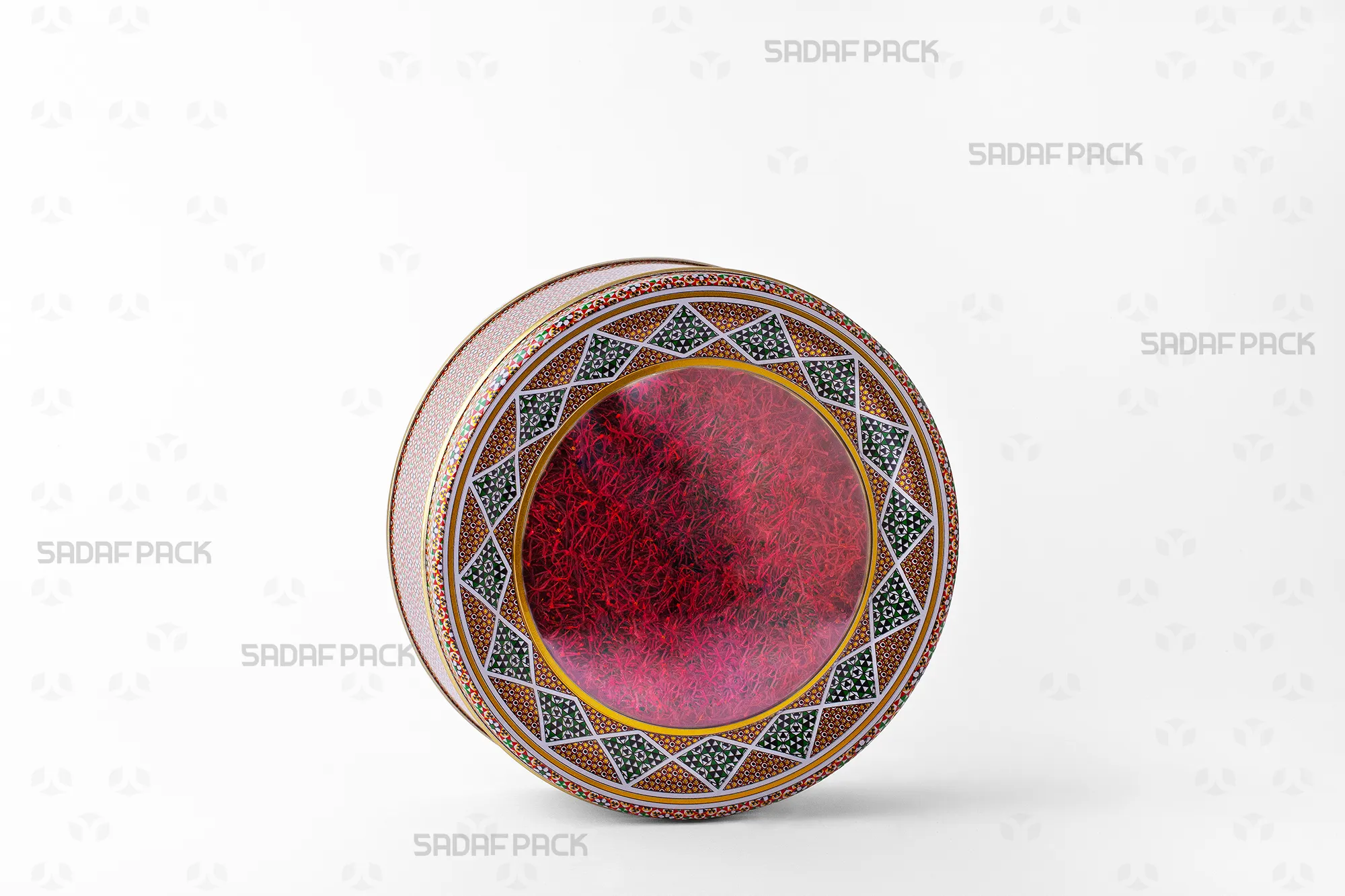 A Sadaf Pack 17 Metal 5 cm circular tin filled with saffron, perfect for premium sweets and dried fruits.