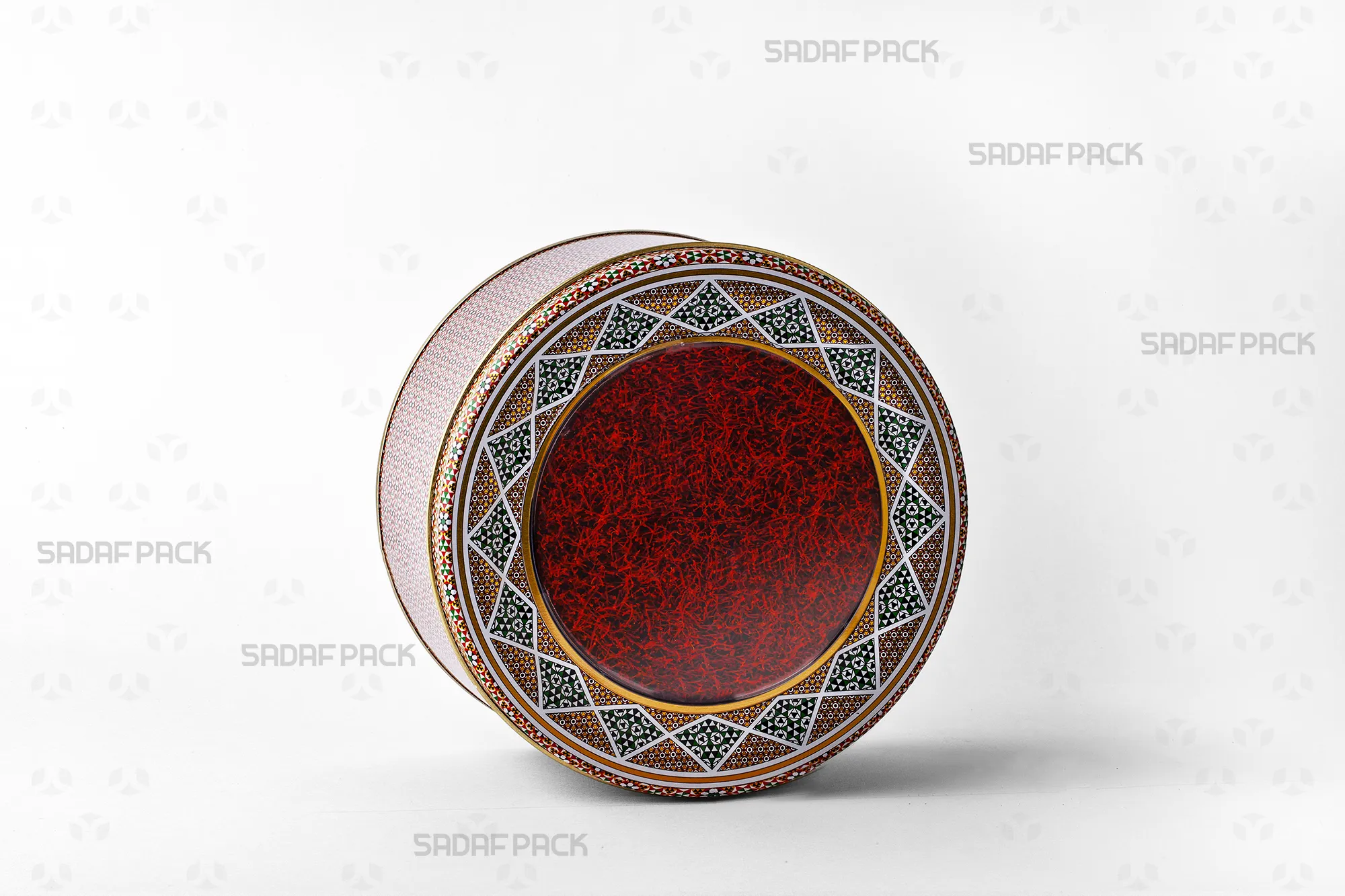 A 17 cm Sadaf Pack metal tin with an 8 cm depth, filled with saffron, showcasing its suitability for luxury date and nut exports.
