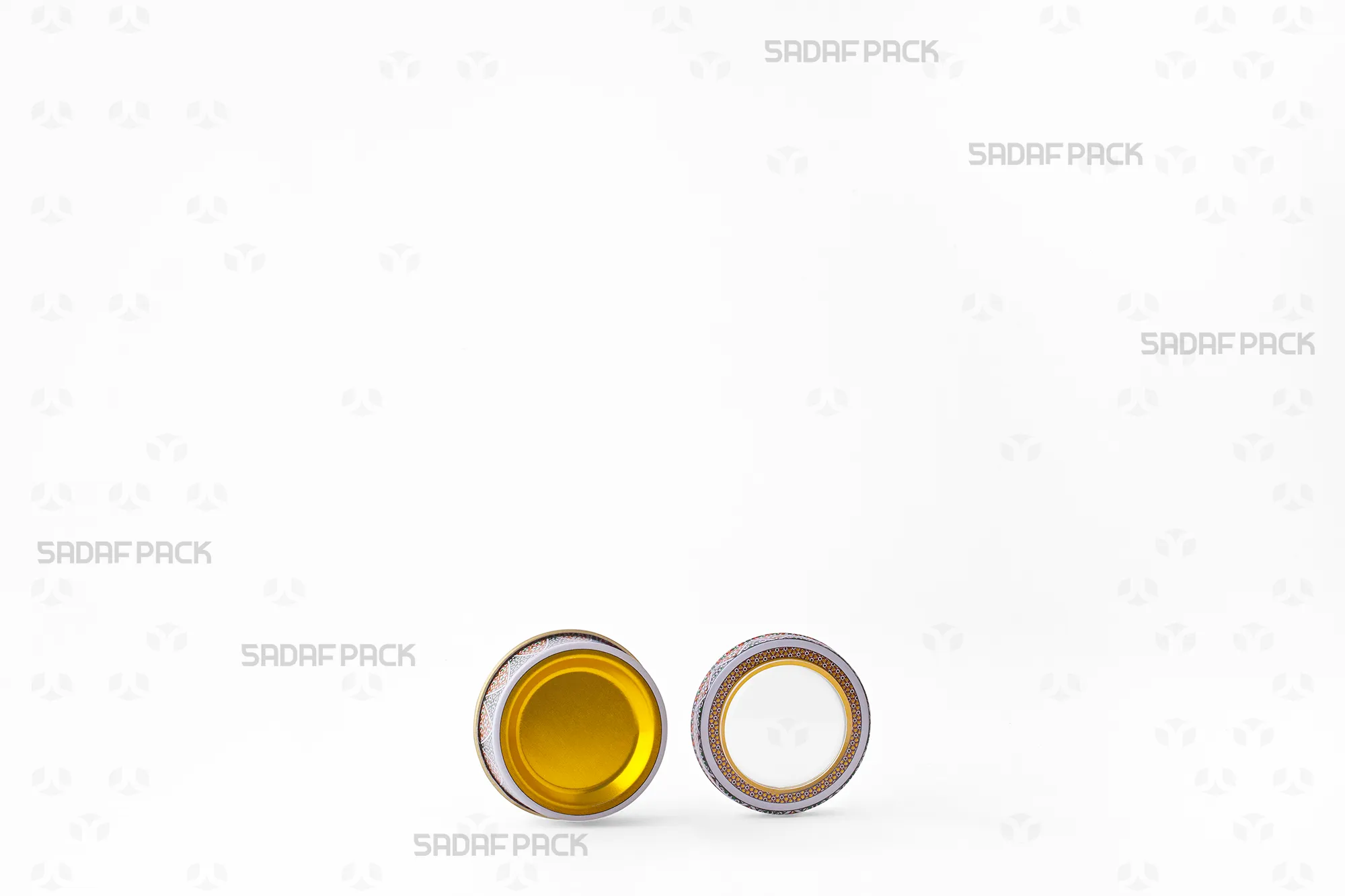 Three-quarter angle view of the 1 gram Metal Tin with its lid and body separated, displaying the clean interior space designed for saffron preservation.