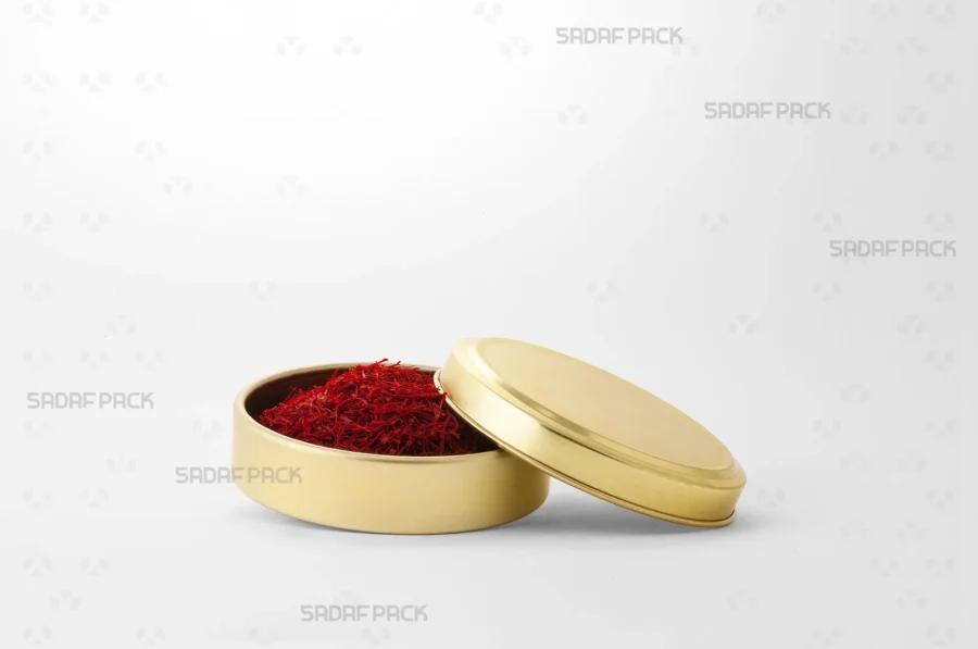 The Gold 9 Metal 2 cm Tin (200 Metal) filled with saffron, demonstrating its suitability for premium, light-protected packaging.