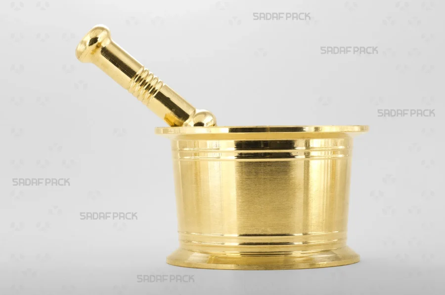 A front view of the Sadaf Pack Traditional Mortar 130. This heavy-duty, cylindrical brass mortar is expertly crafted for grinding saffron and spices, featuring decorative circular lines around the body for a detailed, classic finish.
