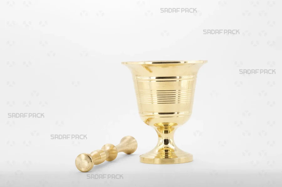 The Sadaf Pack Cup Mortar 100 shown with its matching solid brass pestle resting beside the mortar.