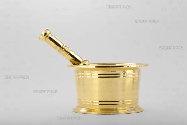 A front view of the Sadaf Pack Traditional Brass Mortar 110, showcasing its sturdy, cylindrical design and the detailed circular lines engraved on its heavy brass body, perfect for grinding saffron and various spices.