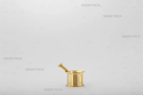 A front view of the Sadaf Pack Traditional Brass Mortar 40, showcasing its sturdy, classic cylindrical design and the detailed circular lines engraved on its heavy body.