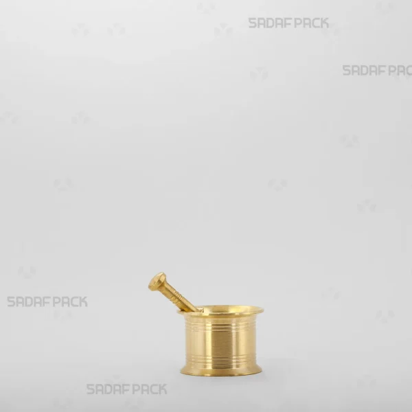 A front view of the Sadaf Pack Traditional Brass Mortar 40, showcasing its sturdy, classic cylindrical design and the detailed circular lines engraved on its heavy body.