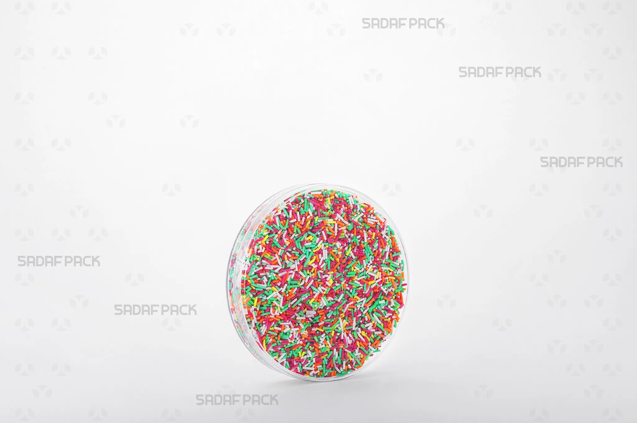 The 10 Core Crystal container filled with premium Rainbow Sprinkles, showcasing its suitability for luxury export markets.