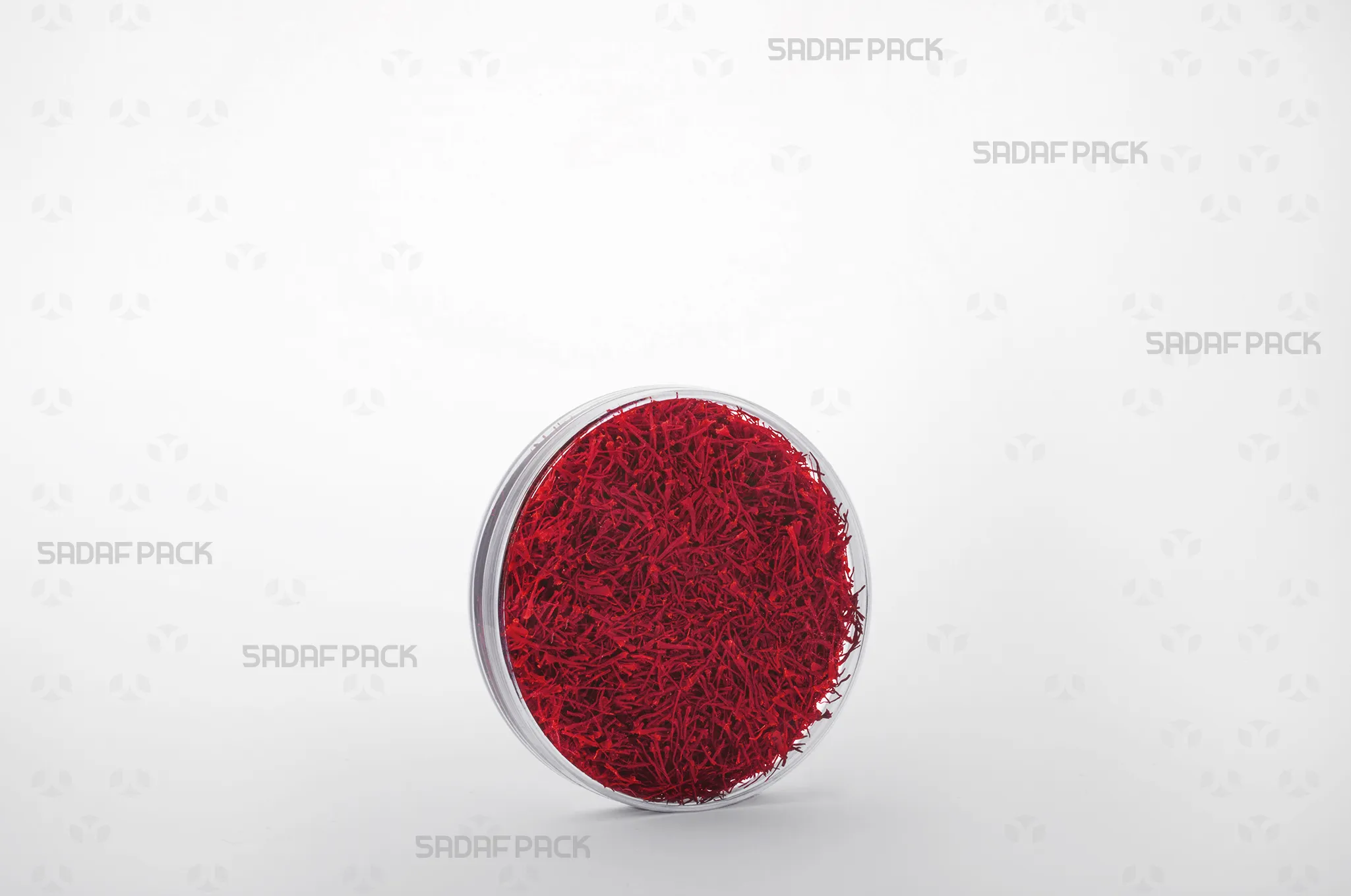 The 10 Core Crystal container filled with premium Iranian saffron, showcasing its suitability for luxury export markets.