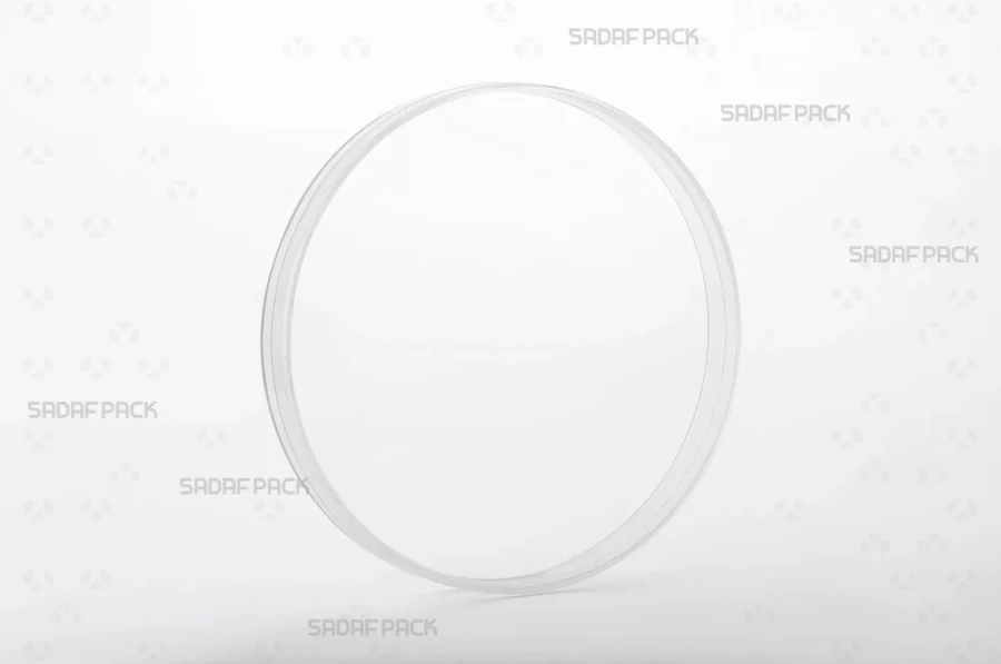 Three-quarter angle view of the 15 Core Crystal container from Sadaf Pack, a large circular container with a deep body designed for premium visibility.