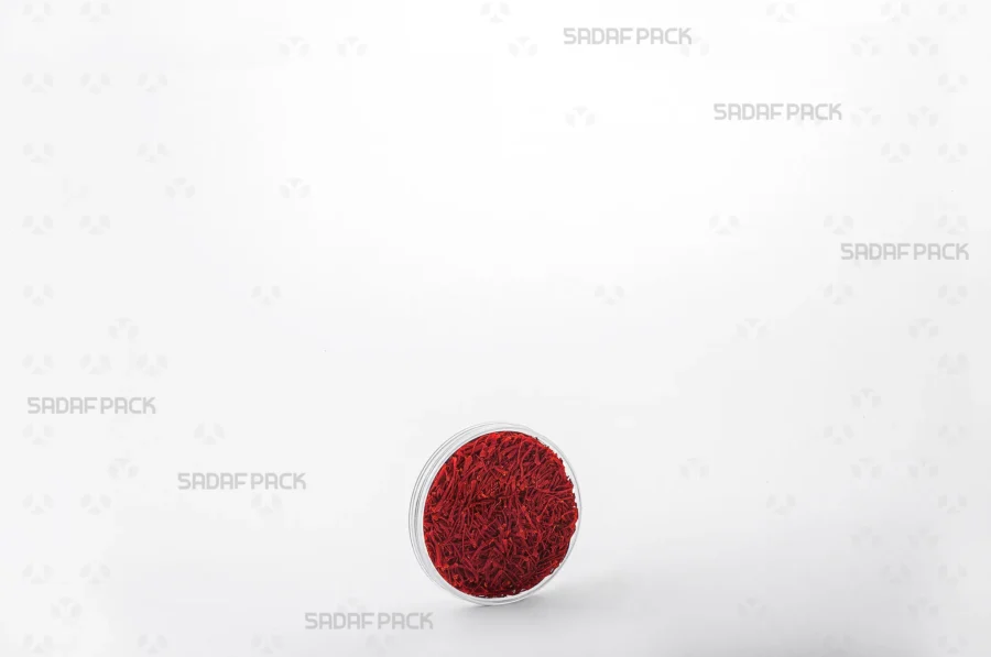 The 5 Flat Crystal container filled with high-quality saffron, demonstrating its suitability for export and luxury retail presentation.