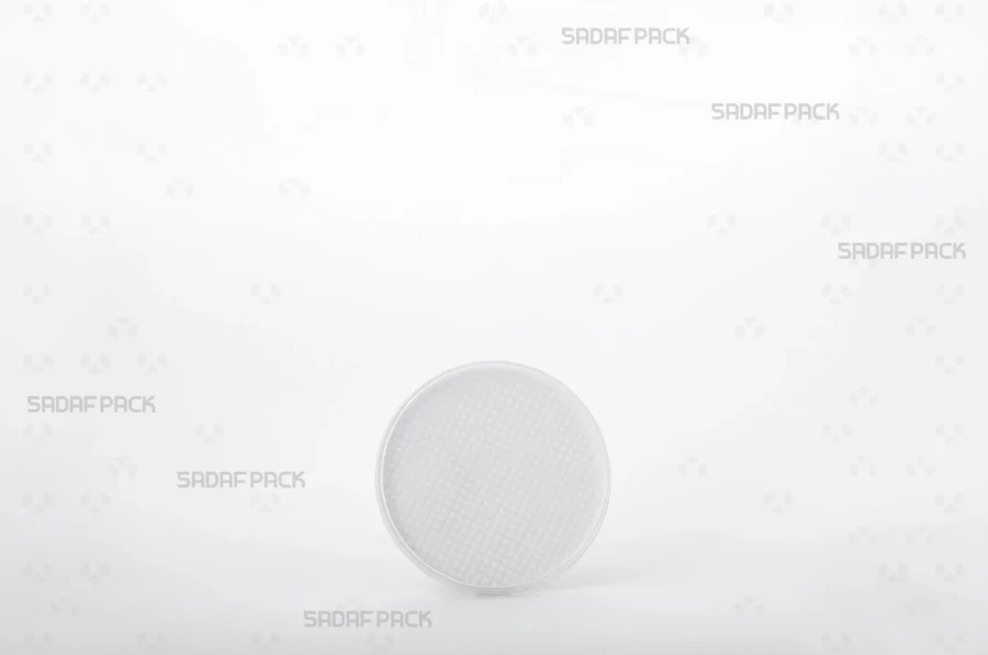 A front angle view of the 6.5 Slim España container, highlighting its slim profile and the clear poly-crystal body with a distinct white bottom.