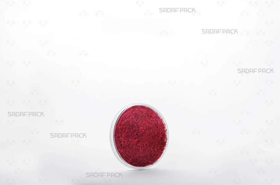 A three-quarter view of the 6.5 Slim España container filled with saffron, showcasing its suitability for high-value export products. 