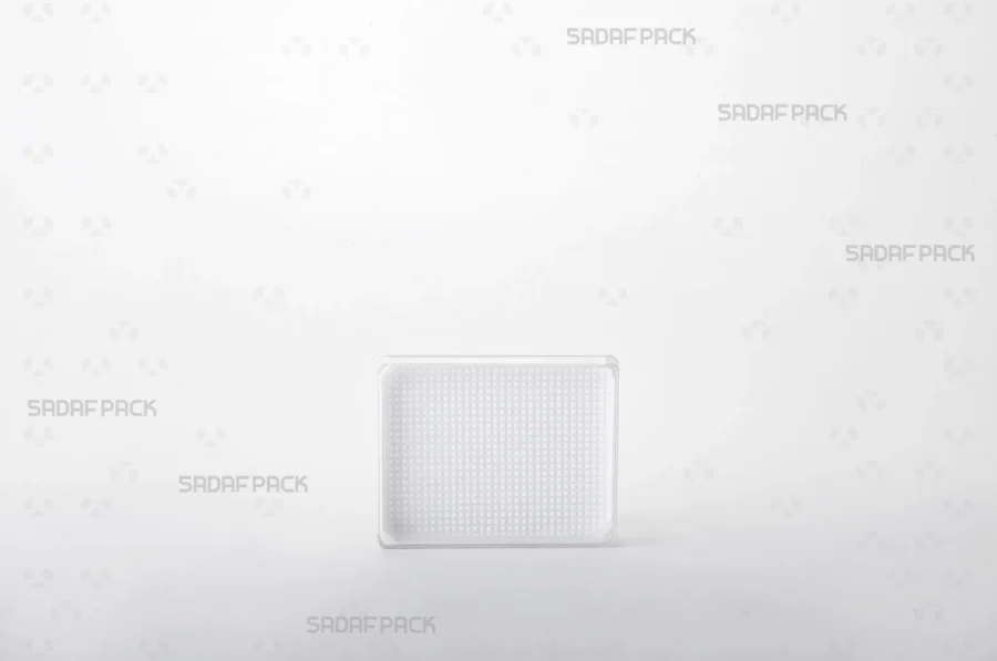 A front-facing view of the 7 España Rectangle container, highlighting its clear polycrystal body and distinctive base design.