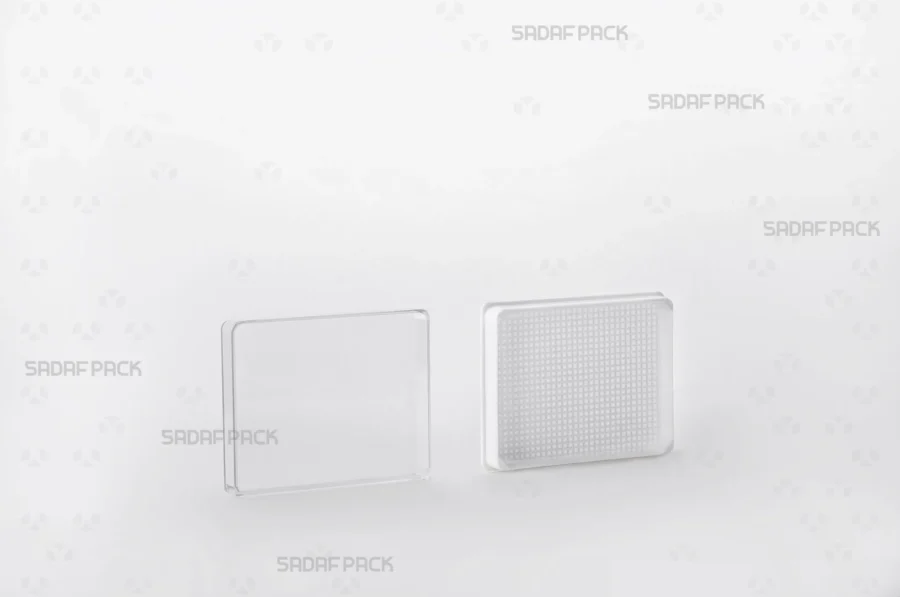 The 7 España Rectangle container shown with its lid and body separated side-by-side, displaying the interior space and secure closure.