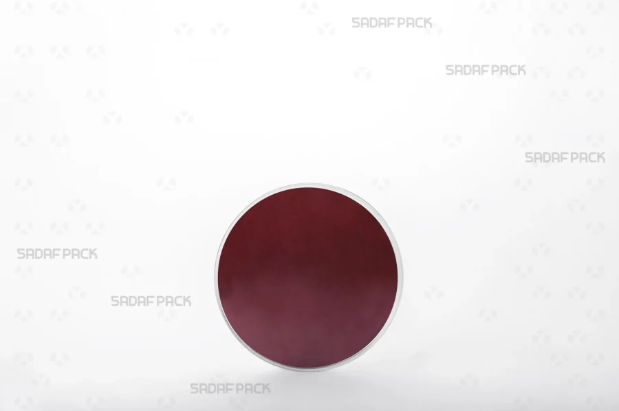 A close-up view of the 9.5 Core Crystal Container with crimson Cardboard Pad