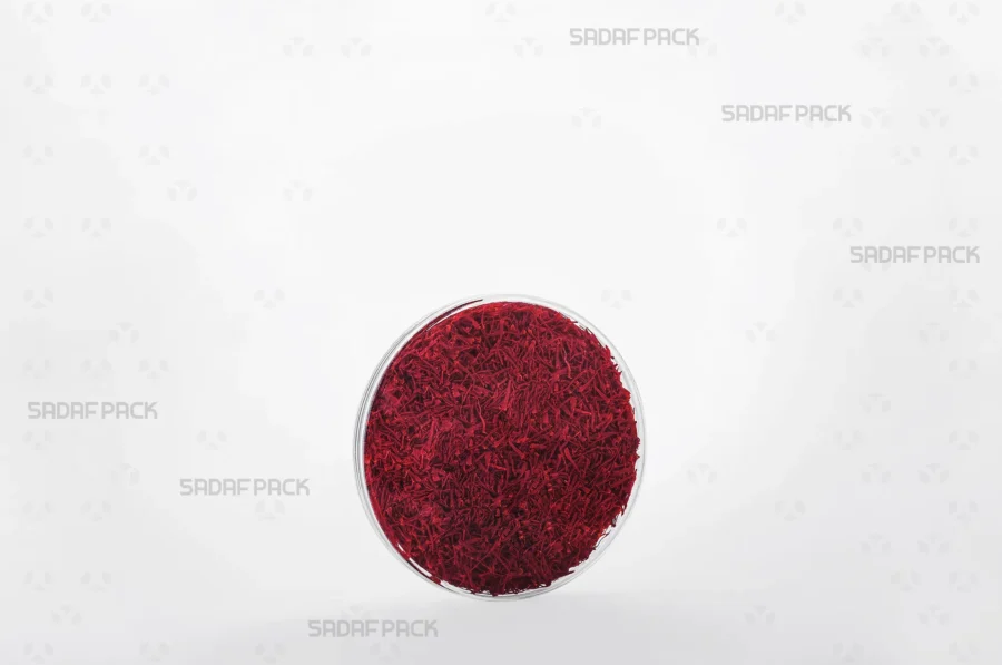 Three-quarter angle view of the 9.5 Core Crystal Container filled with saffron, demonstrating its ideal use for high-value export products.