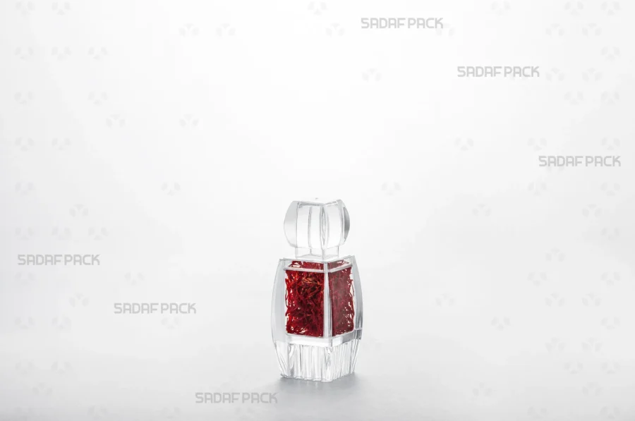 A three-quarter view of the Azin 1 Raised Bottom container filled with high-quality saffron, making it an excellent choice for export.