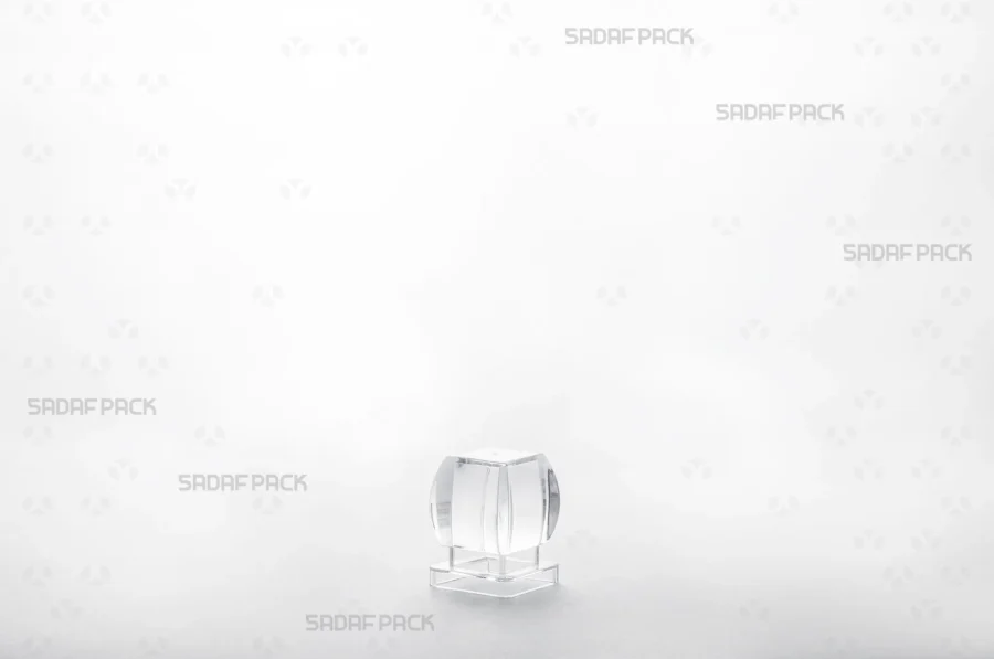 A detailed three-quarter view of the Azin 2 Raised Bottom lid, illustrating its precise fit and smooth, reflective surface.