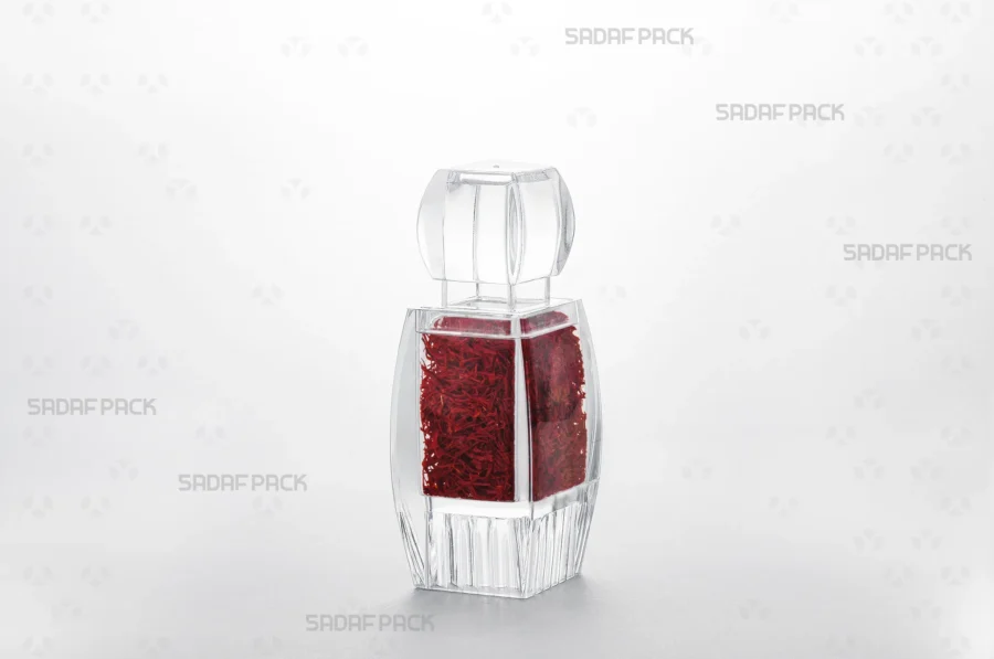 A three-quarter view of the Azin 3 Raised Bottom container filled with saffron, showcasing its capacity and suitability for luxury export products.