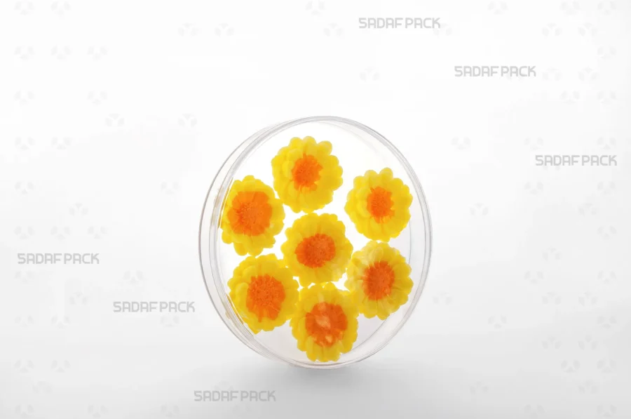 A three-quarter angle view of the 12 Core Crystal Container filled with Decorative candy, demonstrating its suitability for export-quality packaging.
