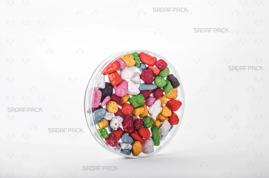 A three-quarter angle view of the 12 Core Crystal Container filled with chocolate rocks, demonstrating its suitability for export-quality packaging.