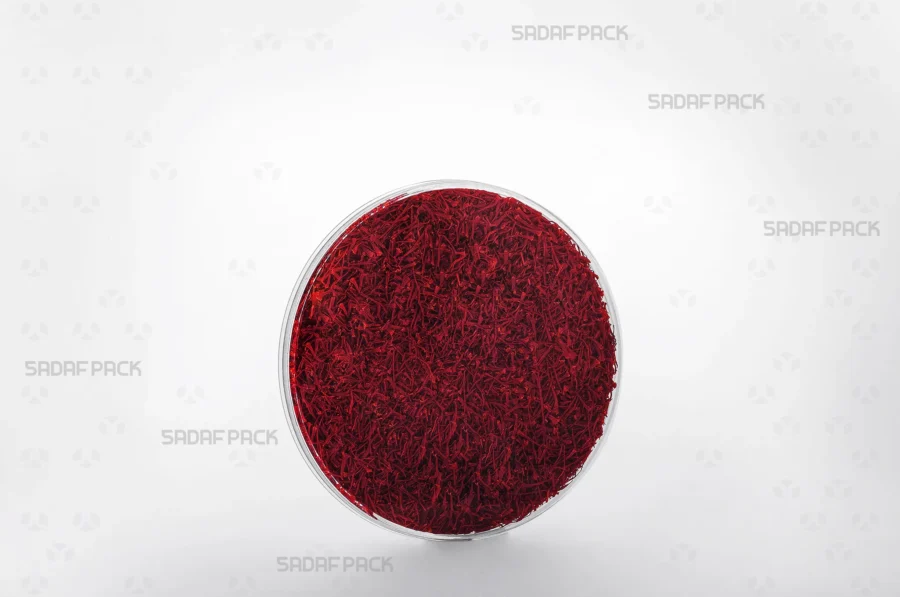 A 12 Flat Crystal container filled with saffron, demonstrating its elegant presentation for luxury food items suitable for export.
