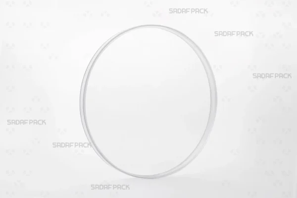 Three-quarter view of the 15 Flat Crystal container by Sadaf Pack, a circular polycrystal container for luxury saffron packaging.