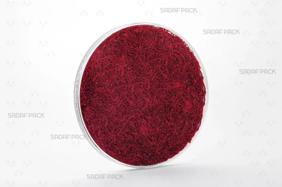 A 15 Flat Crystal container filled with saffron, demonstrating its use for premium export-quality products.