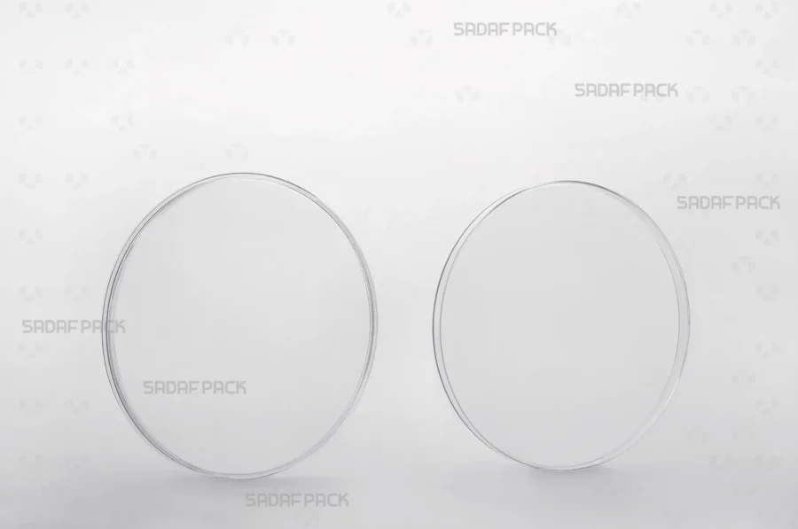 A side-by-side view of the 11 Slim Crystal container's body and lid, revealing its clean interior space designed for saffron.