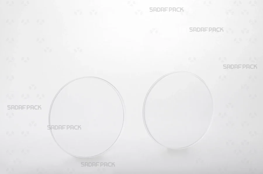 The 9.5 Flat Crystal container shown with its lid and body separated side-by-side, displaying the smooth interior surface and precise fit for optimal product protection.