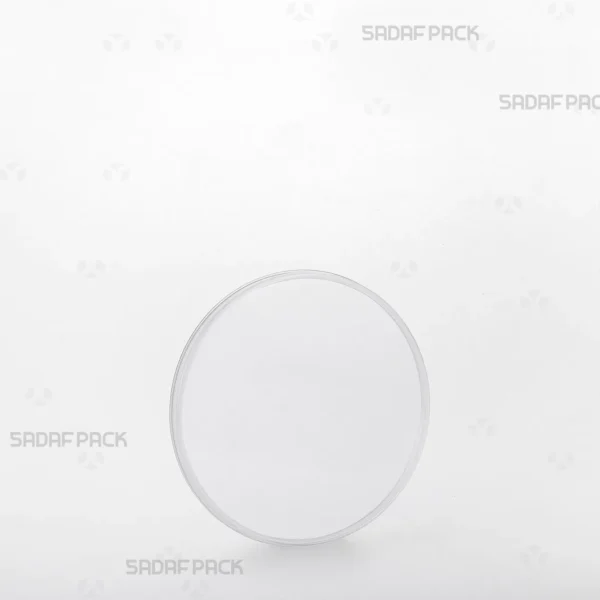 A three-quarter angle view of the 9.5 Slim Crystal container by Sadaf Pack, showcasing its transparent design for premium saffron display.