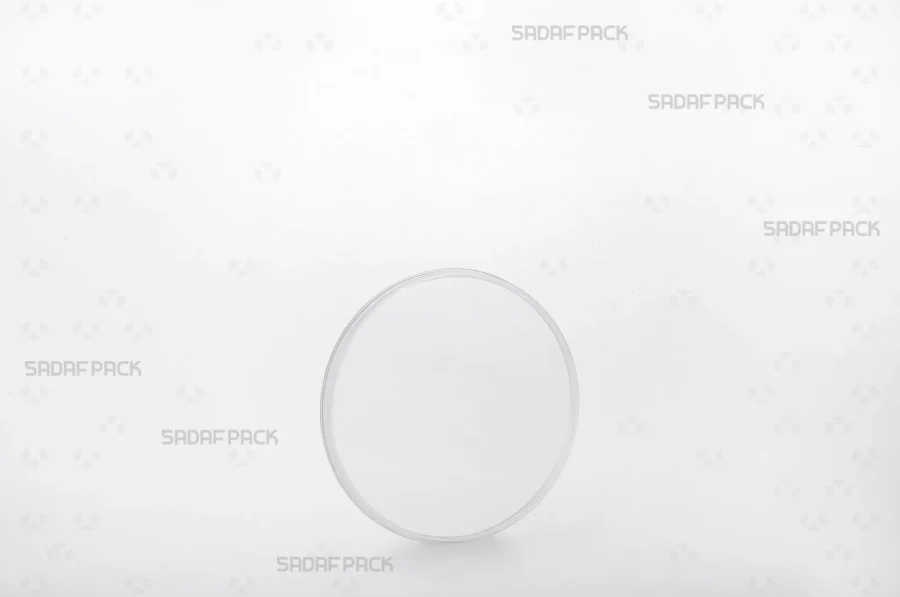 A three-quarter angle view of the 9.5 Slim Crystal container by Sadaf Pack, showcasing its transparent design for premium saffron display.