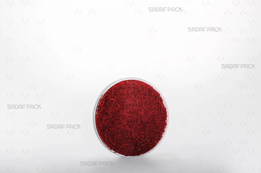An elegant three-quarter view of the 9.5 Slim Crystal container filled with saffron, demonstrating its suitability for export-quality products.