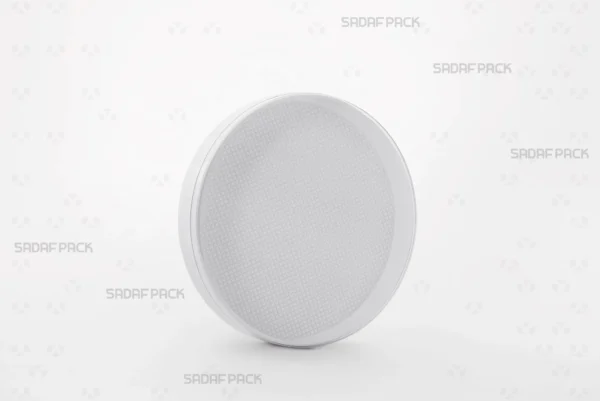Three-quarter angle view of the 12 Core España crystal container by Sadaf Pack, showcasing its round design and clear lid for saffron packaging.