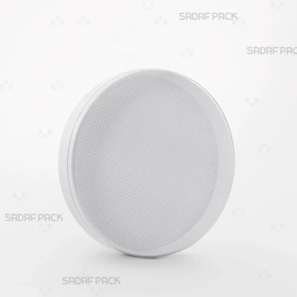 Three-quarter angle view of the 12 Core España crystal container by Sadaf Pack, showcasing its round design and clear lid for saffron packaging.
