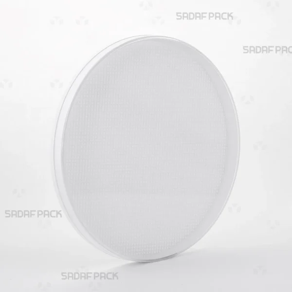 A three-quarter angle view of the 15 Medium España round crystal container by Sadaf Pack, designed for premium saffron packaging.