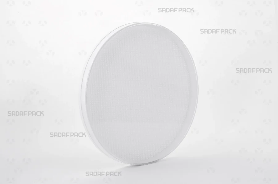 A three-quarter angle view of the 15 Medium España round crystal container by Sadaf Pack, designed for premium saffron packaging.