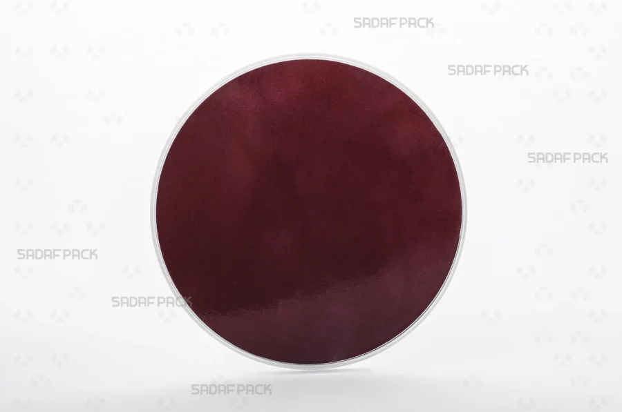 A three-quarter angle view of the 15 Medium España container filled with size 15 crimson Cardboard Pad