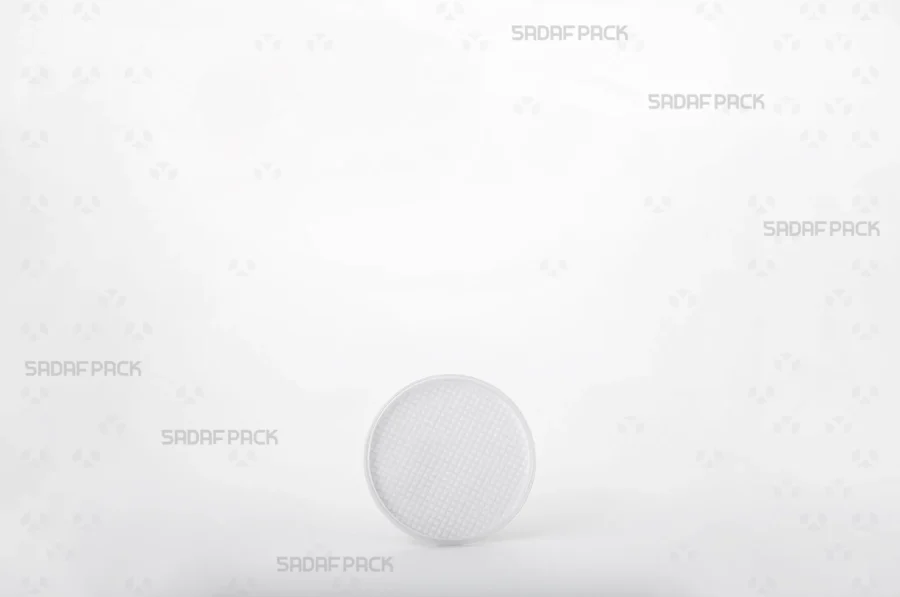 A front view of the 5 España container, highlighting its circular structure and the pristine clarity of its poly-crystal material.