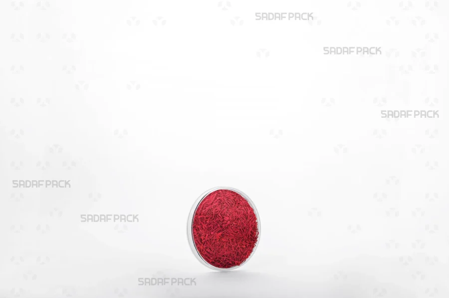 A detailed view of the 5 España container filled with vibrant saffron, demonstrating its suitability for export-quality spices. 